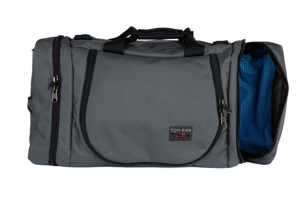 A Nebulous Grey (medium grey) Ballistic Aeronaut 45 with the end pocket open showing the Island (blue) Halcyon.